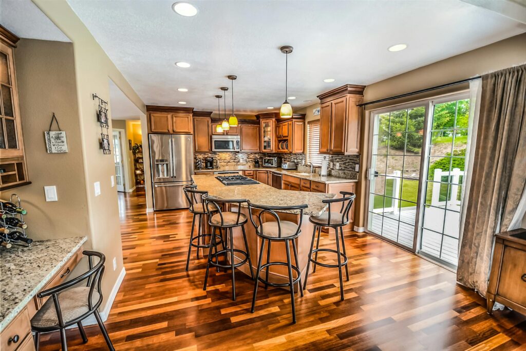a luxurious modern kitchen featuring hardwood floors and granite countertops 534151 scaled